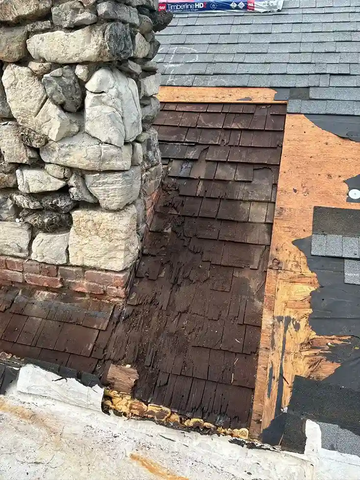 Application of sealant to stone chimney flashing