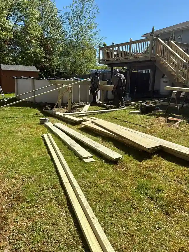 Quality check of level deck boards and railings during construction
