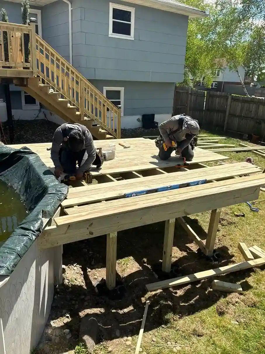 Maintenance-free composite decking boards in grey wood tone