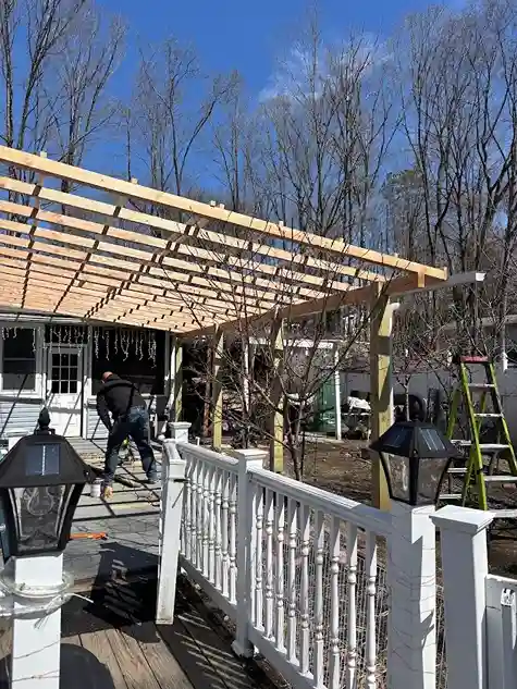 Renovated wooden deck with modern clean lines and new railing