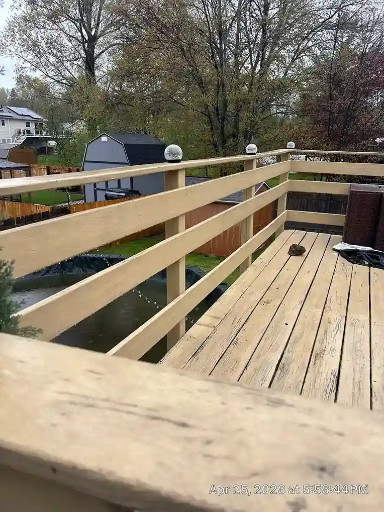 Wooden deck railing with decorative solar cap post lights