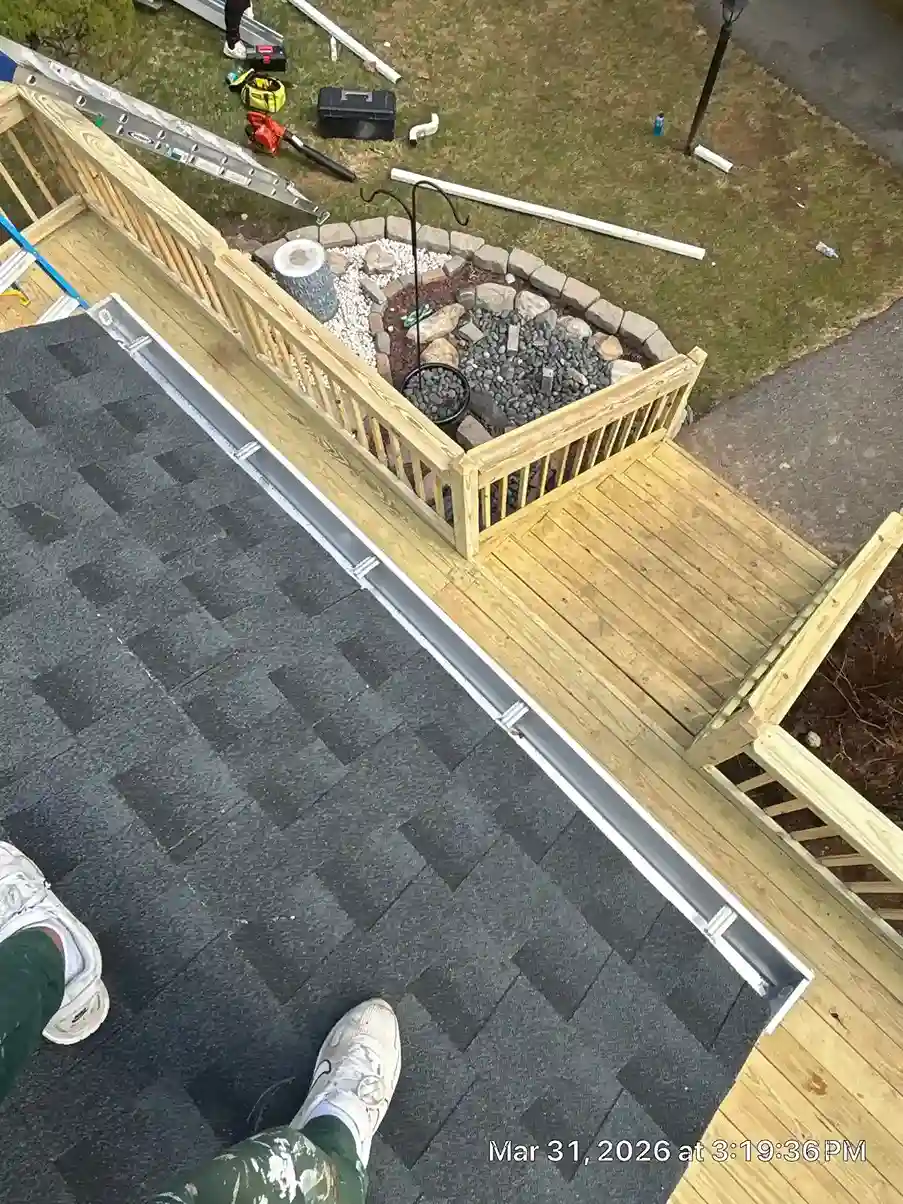 Downspout extension directing rain water away from foundation