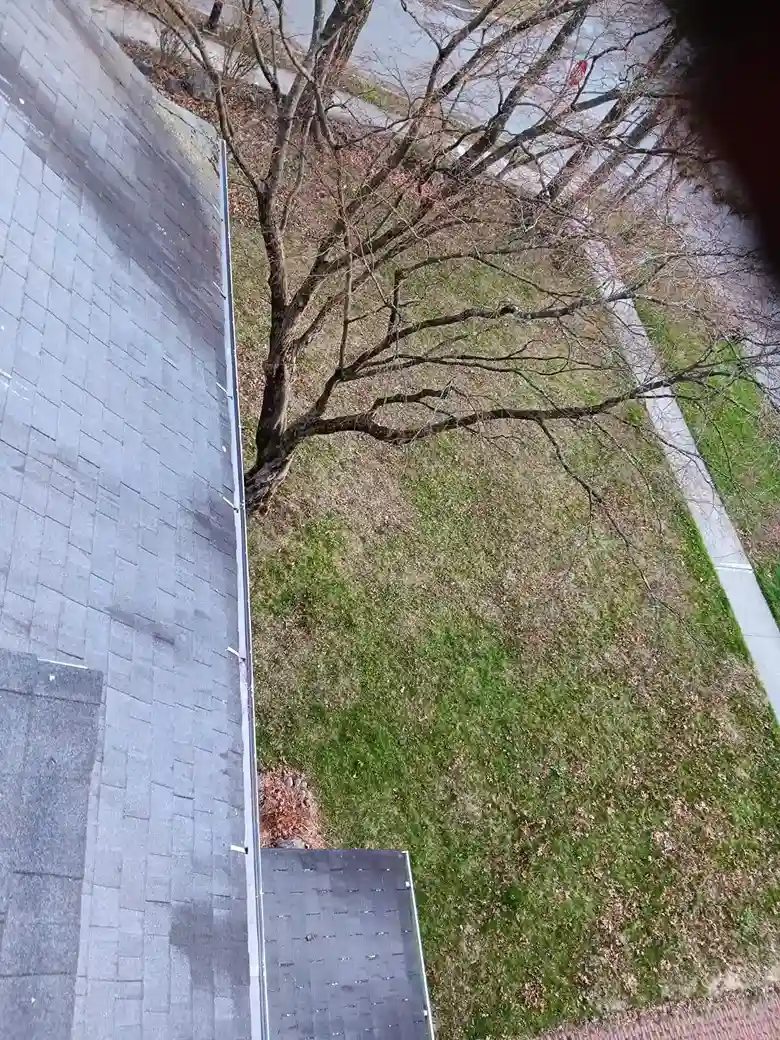Installation of rainwater diverter system connected to downspout