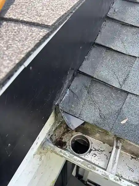 Gutter installation showing secure bracket and hanger spacing