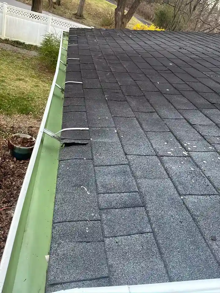 Sealing leaky gutter corner joints with heavy duty sealant
