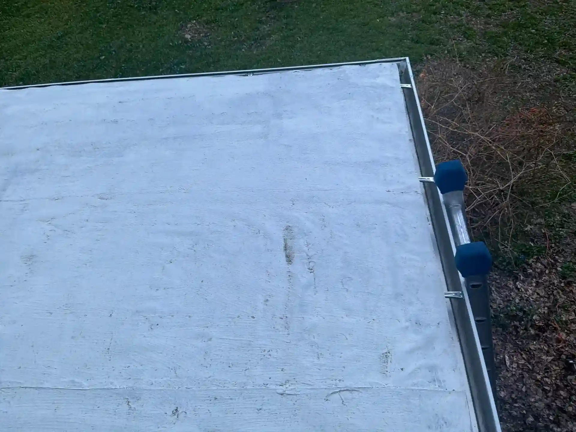 Testing gutters for leaks and proper water flow after install