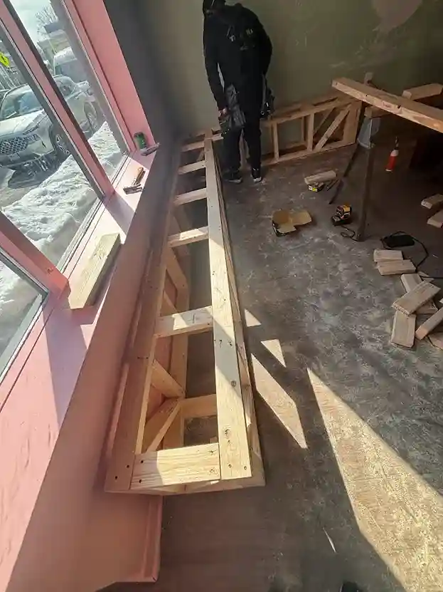 Installation of premium hardwood flooring in open plan living area