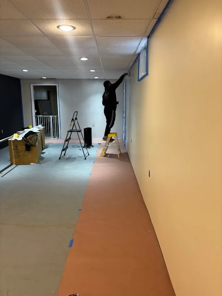 Painting a dark blue accent wall in a modern bedroom design