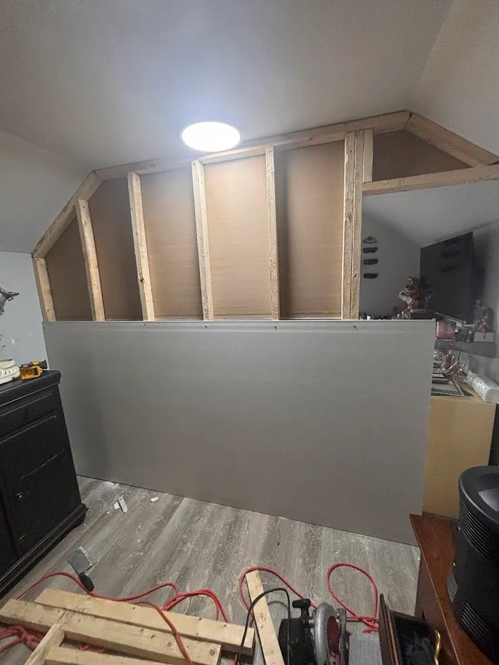 Renovating wooden staircase with clean white and grey finishes