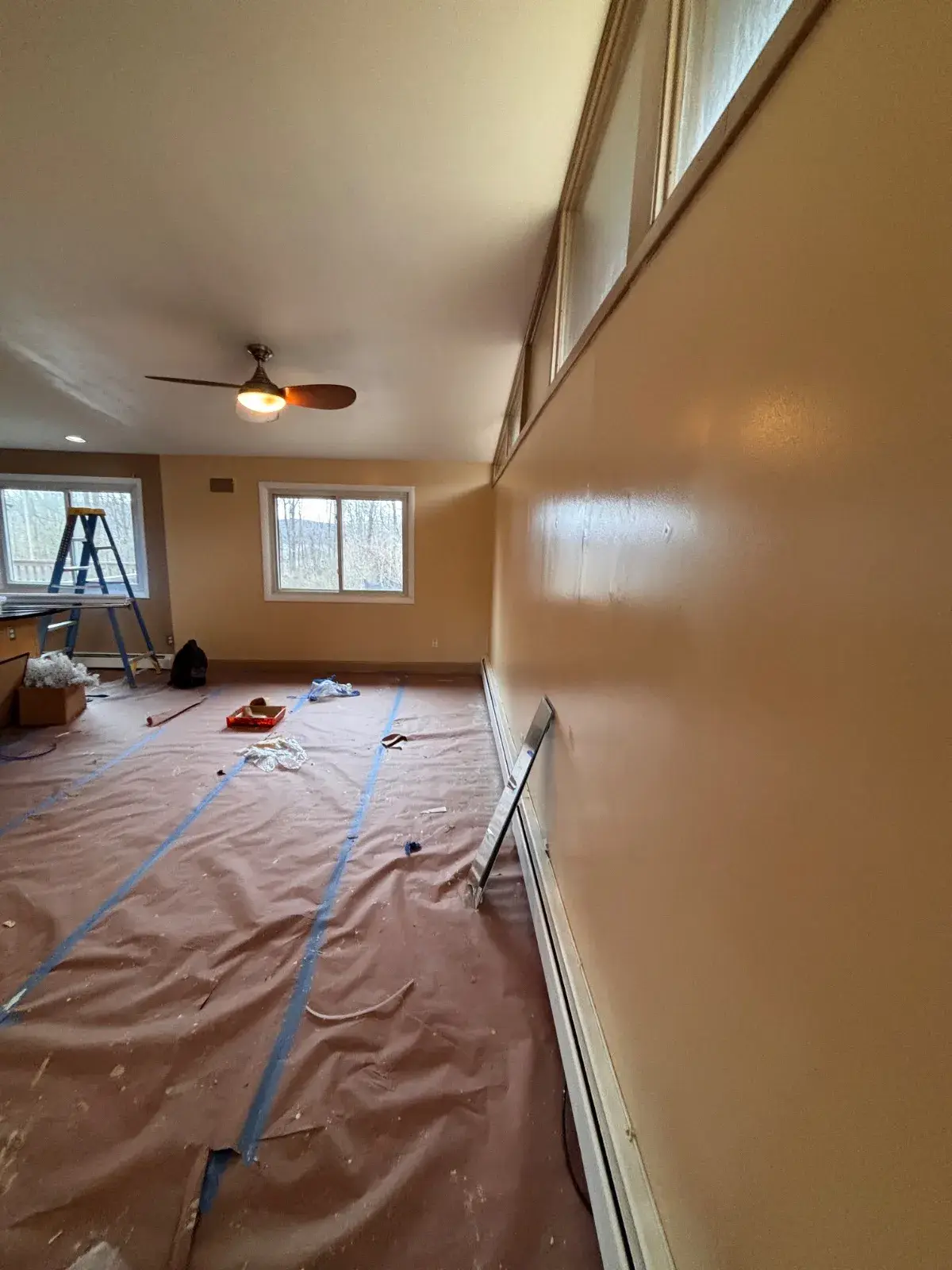 Room prepared for painting with brown paper floor protection