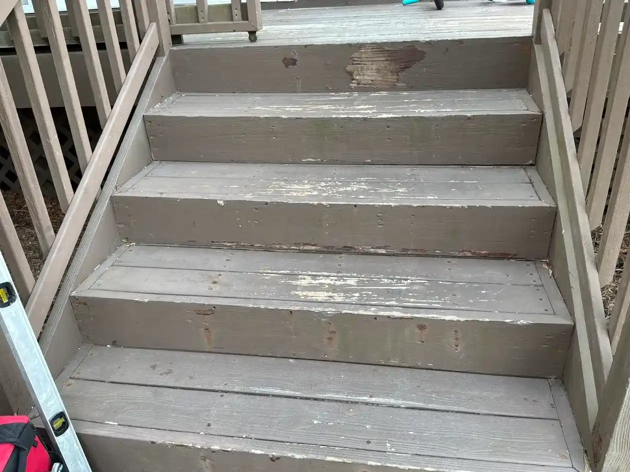 Modern minimalist metal railing on a concrete exterior walkway