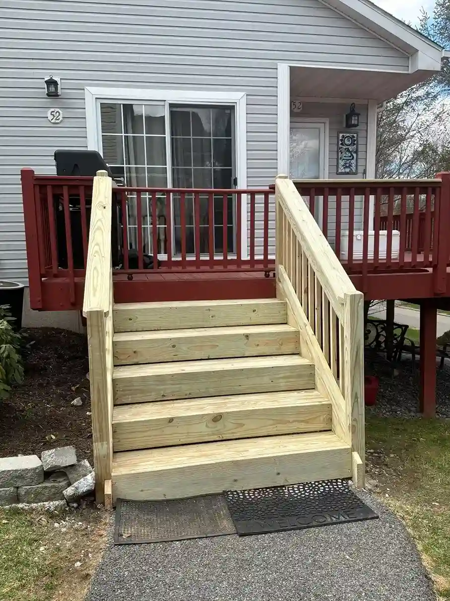 Traditional white wood picket railing on a front porch