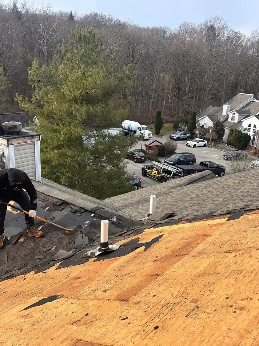 Clean lines of a newly shingled roof valley on a house