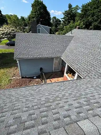 Corrugated metal roofing sheets installation on a shed