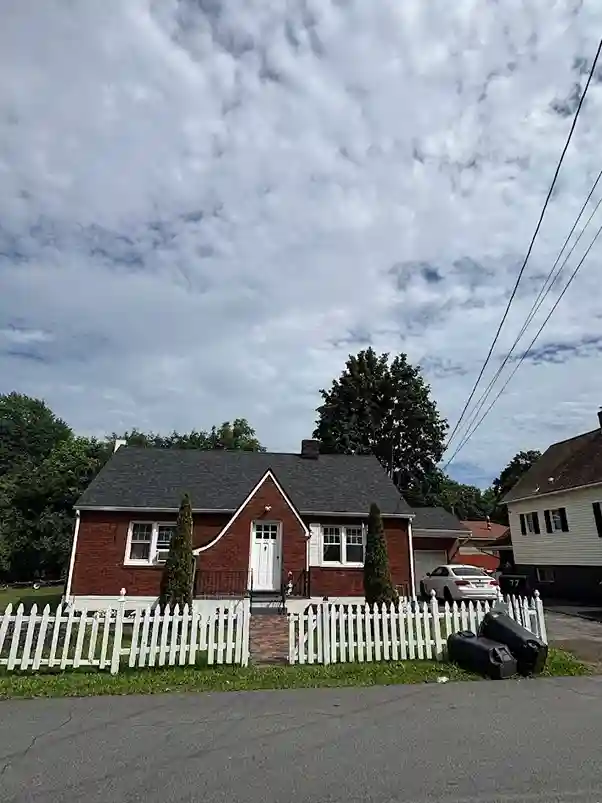 Removing moss and power washing asphalt shingle roof